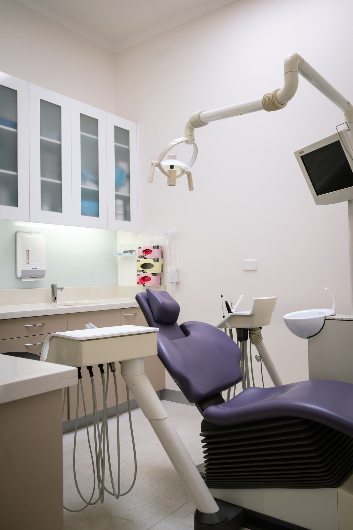 The dental chair and overhead light in a treatment room at Flinders Dental Practice