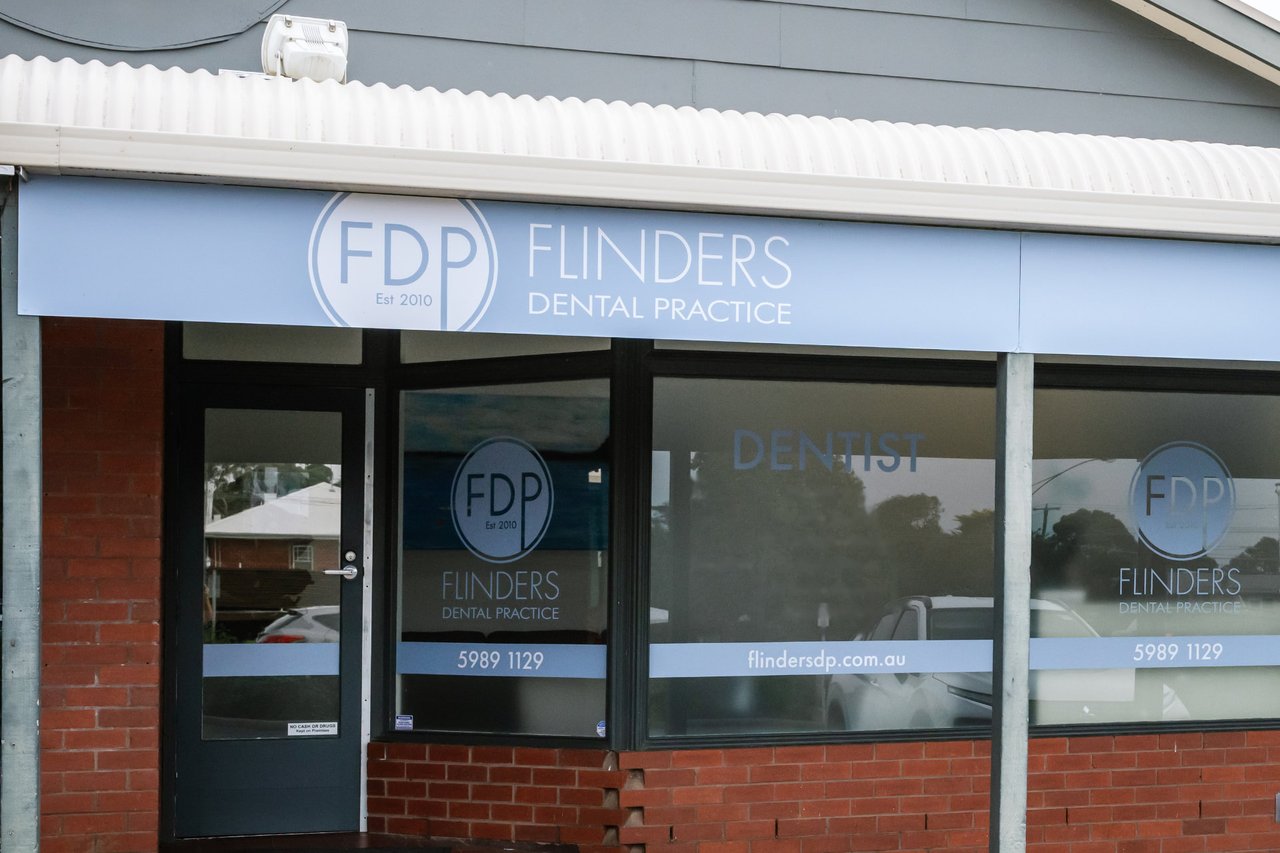 The front of Flinders Dental Practice on Cook St, with its blue sign above the windows